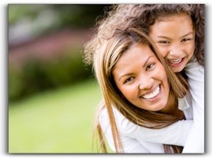 A lady and girl is smiling