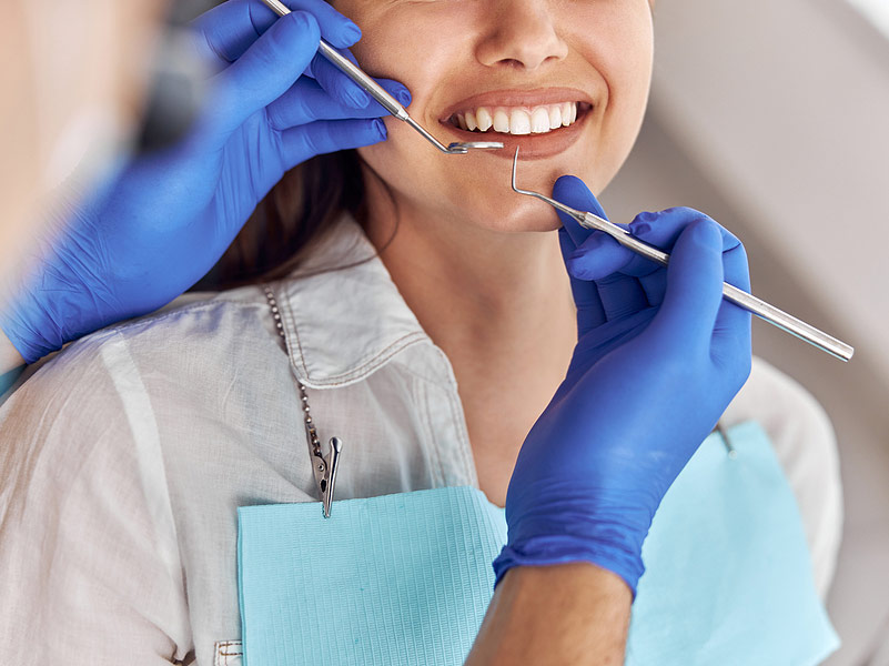 dentist cleaning teeth