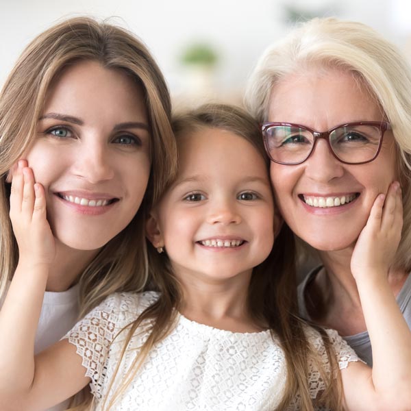 three generations of women smiling