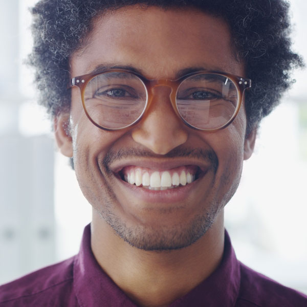 adult male with glasses smiling