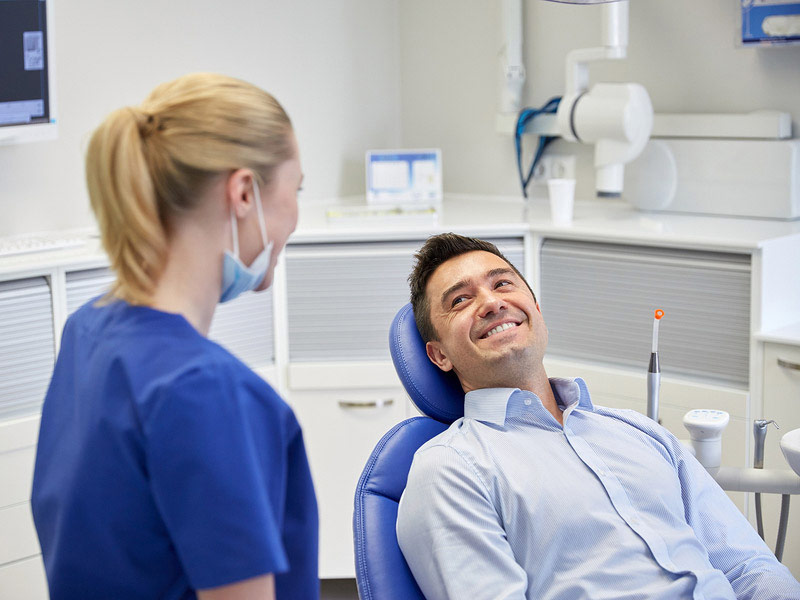 Men given a smile to a dentist