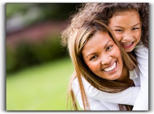 A lady and girl is smiling